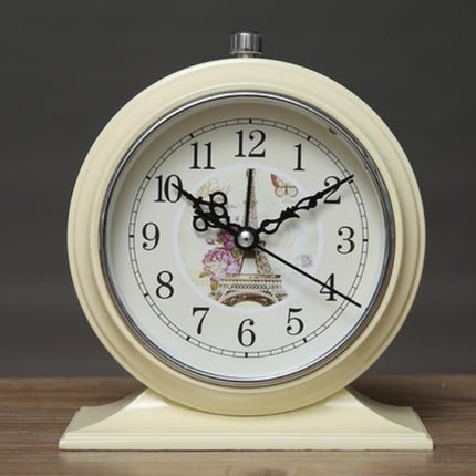 Rundt retro vækkeur med blomstermotiv