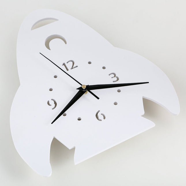 Hvidt vægur formet som raket