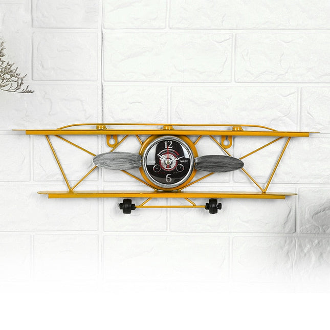 Vintage vægur formet som flyvemaskine