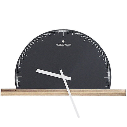 Halvrundt minimalistisk vægur til hylde
