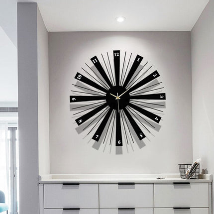 Moderne sort vægur i sunburst design