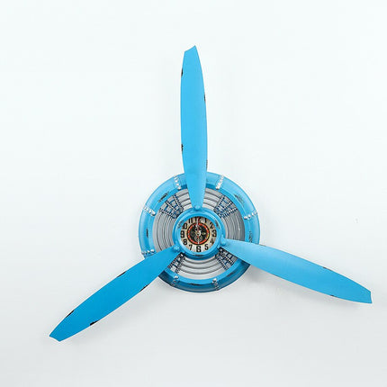 Industrielt vægur formet som flypropel