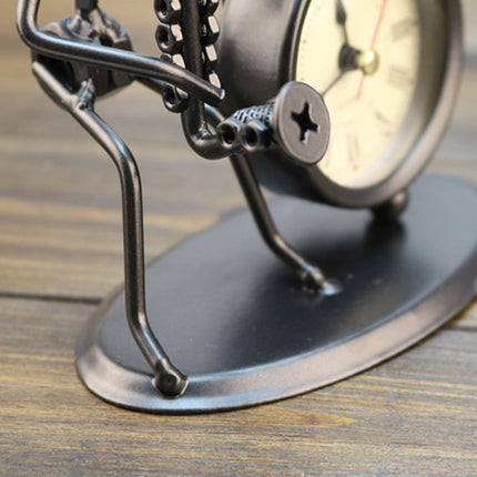 Dekorativt bordur i jern med figur