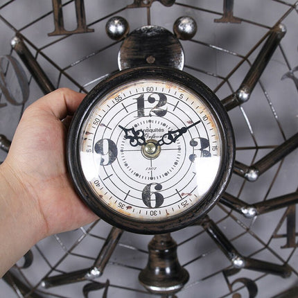 Industrielt vægur i edderkop design