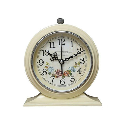 Rundt retro vækkeur med blomstermotiv