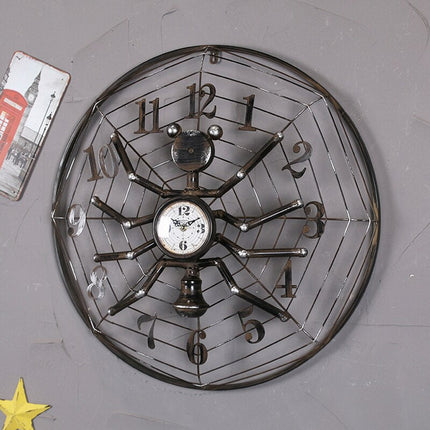 Industrielt vægur i edderkop design