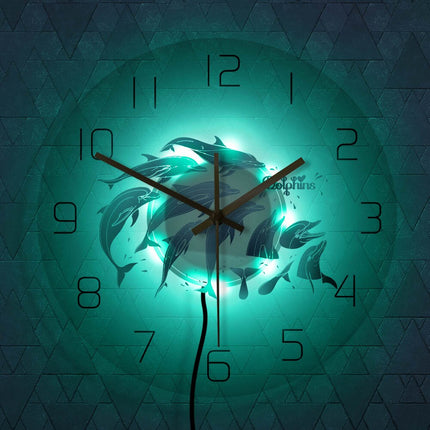 Moderne vægur med blå delfiner