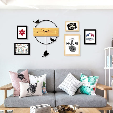 Moderne vægur med pendul og fugle