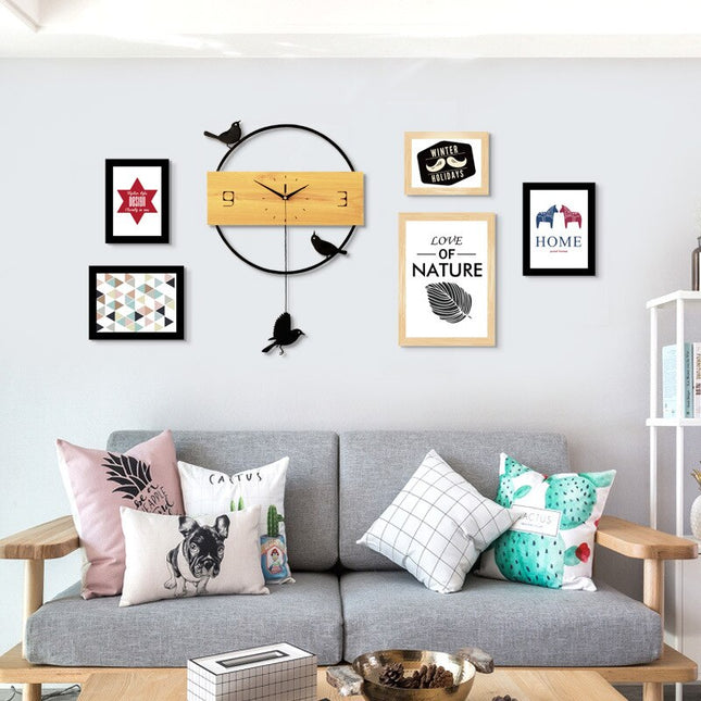 Moderne vægur med pendul og fugle