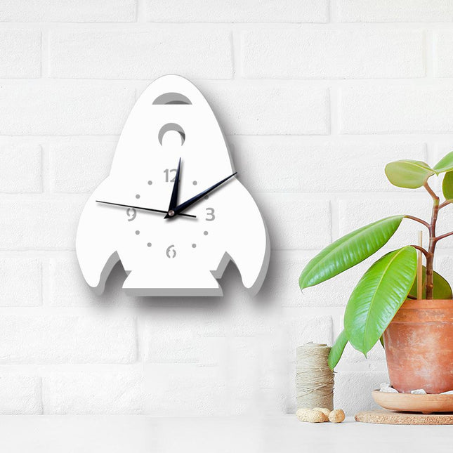 Hvidt vægur formet som raket