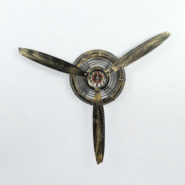 Industrielt vægur formet som flypropel